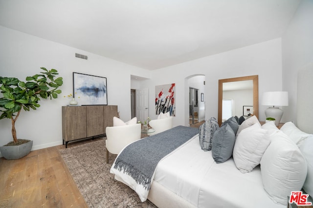 bedroom with wood-type flooring