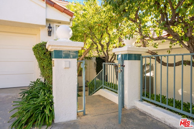 view of gate featuring a garage