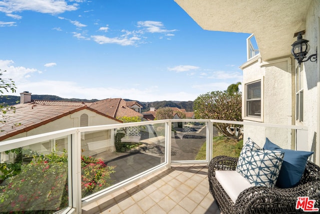 balcony featuring a mountain view