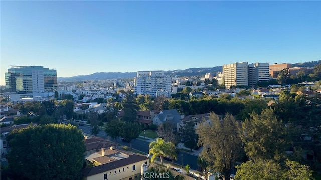 birds eye view of property featuring a mountain view