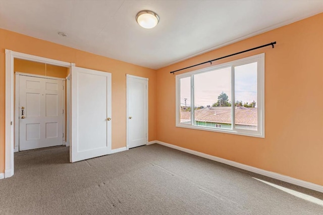 unfurnished bedroom with carpet