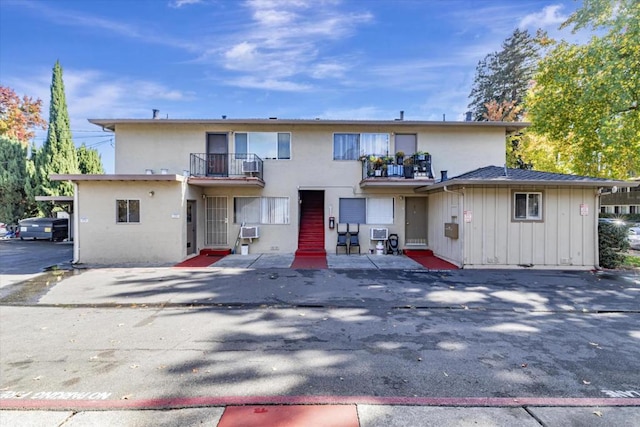 back of property with a balcony