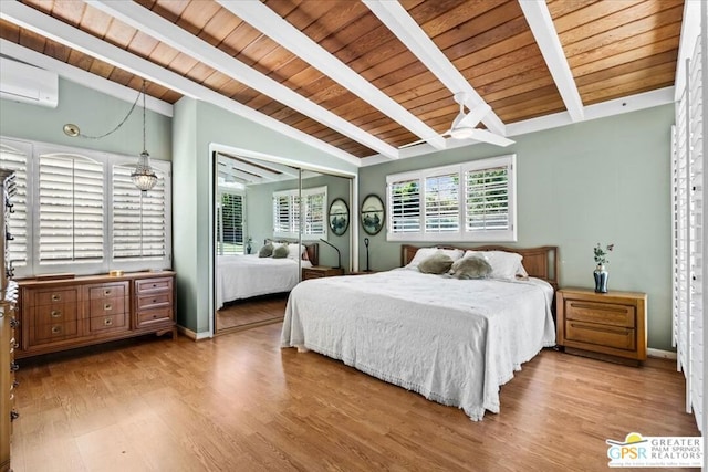 bedroom with vaulted ceiling with beams, wooden ceiling, an AC wall unit, and light hardwood / wood-style flooring