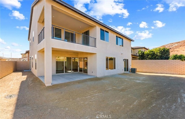 11722 Canoga Dr, Chatsworth, CA 91311 - rear view of property featuring stucco siding, a patio, and a fenced backyard