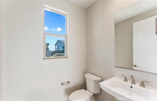 bathroom featuring toilet and sink