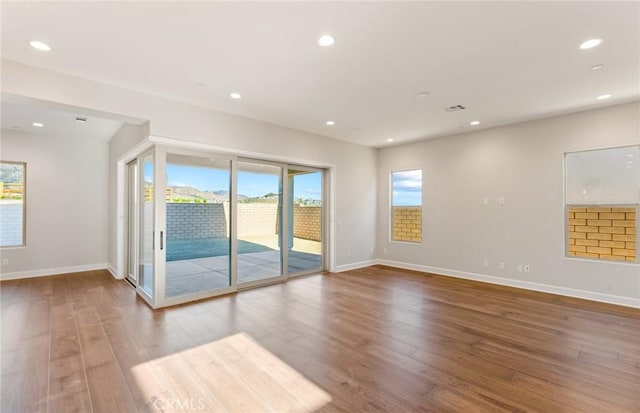 11722 Canoga Dr, Chatsworth, CA 91311 - empty room featuring wood finished floors and recessed lighting