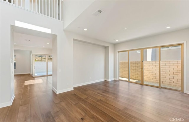 empty room with wood-type flooring