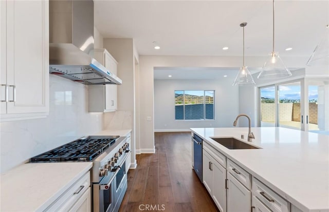 11722 Canoga Dr, Chatsworth, CA 91311 - kitchen featuring appliances with stainless steel finishes, wall chimney exhaust hood, dark wood-style floors, white cabinets, and tasteful backsplash