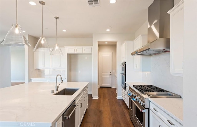 11722 Canoga Dr, Chatsworth, CA 91311 - kitchen with wall chimney exhaust hood, stainless steel appliances, decorative backsplash, recessed lighting, and white cabinets