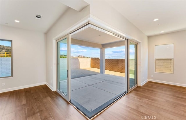 11722 Canoga Dr, Chatsworth, CA 91311 - doorway to outside with wood finished floors and recessed lighting