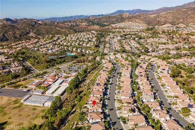 birds eye view of property featuring a mountain view