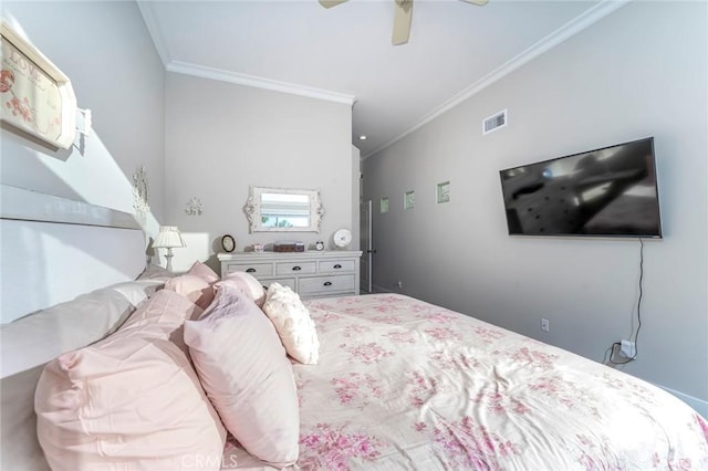 bedroom with ceiling fan and crown molding