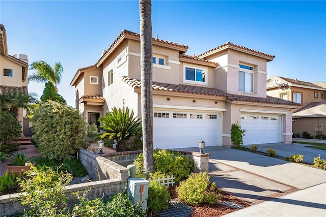 mediterranean / spanish-style house featuring a garage