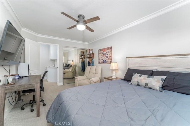 carpeted bedroom with ceiling fan, a closet, and ornamental molding