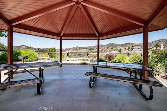 exterior space with a gazebo and a mountain view