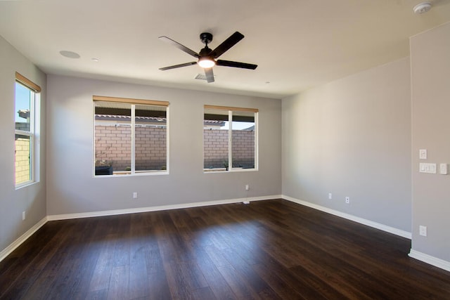 unfurnished room featuring dark hardwood / wood-style flooring and ceiling fan