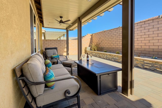 view of patio / terrace featuring ceiling fan and an outdoor living space