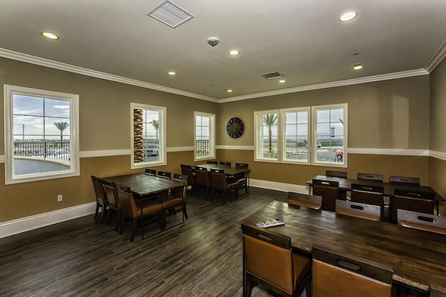 dining room featuring ornamental molding and dark wood-type flooring