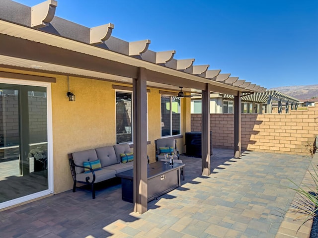 view of patio featuring outdoor lounge area and a mountain view