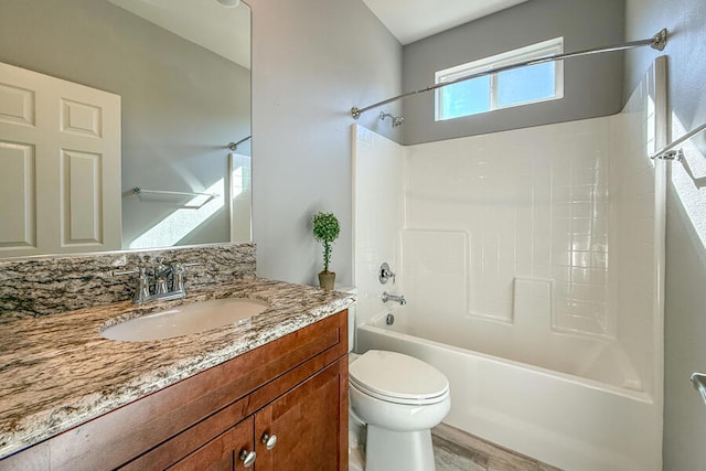 full bathroom with vanity, toilet, shower / bathing tub combination, and hardwood / wood-style flooring