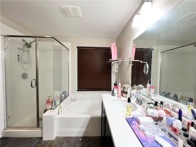 bathroom featuring tile patterned flooring, vanity, and separate shower and tub