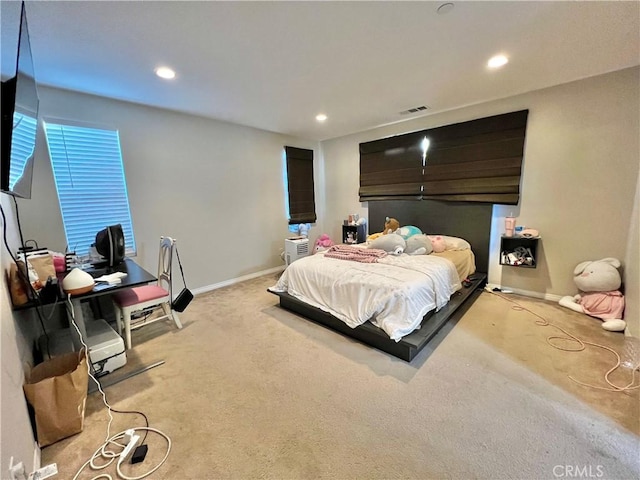 bedroom featuring light carpet