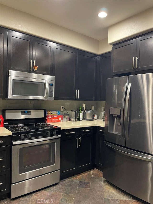 kitchen with backsplash and stainless steel appliances