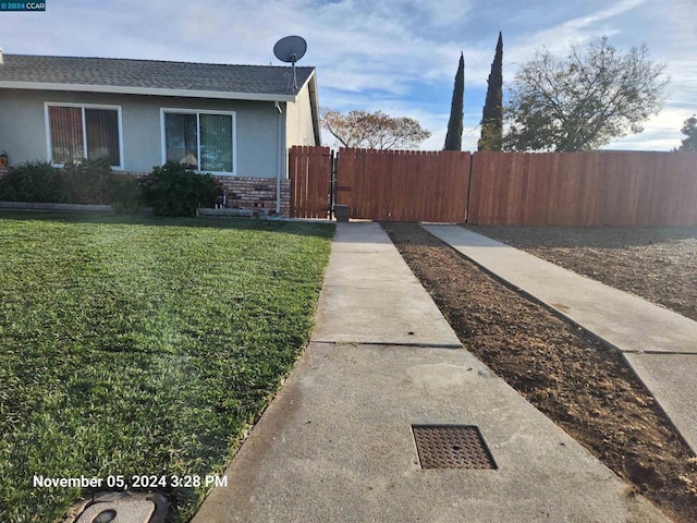 view of home's exterior featuring a lawn