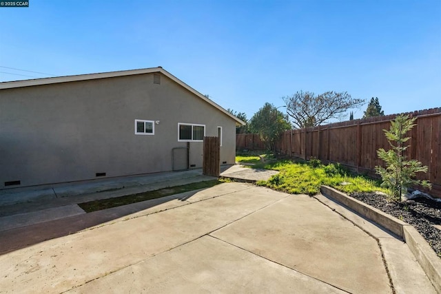 view of home's exterior with a patio