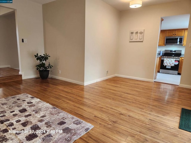 unfurnished living room with light wood-type flooring