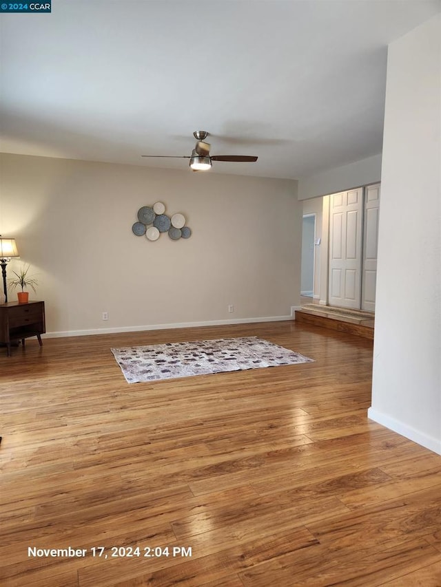 empty room featuring ceiling fan and light wood-type flooring