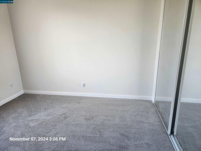 unfurnished room with carpet flooring