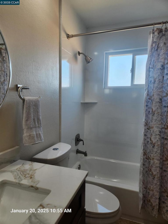 full bathroom featuring shower / tub combo with curtain, vanity, and toilet