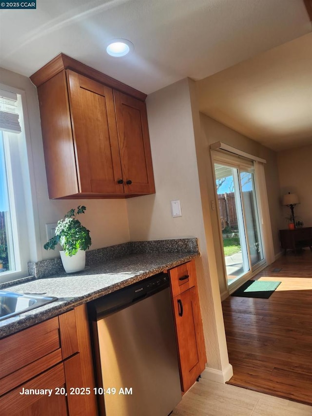 kitchen featuring light hardwood / wood-style floors and dishwasher