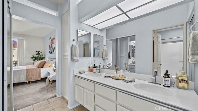 bathroom featuring tile patterned flooring and vanity