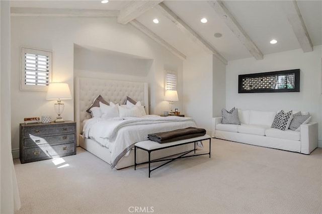 bedroom featuring carpet and vaulted ceiling with beams