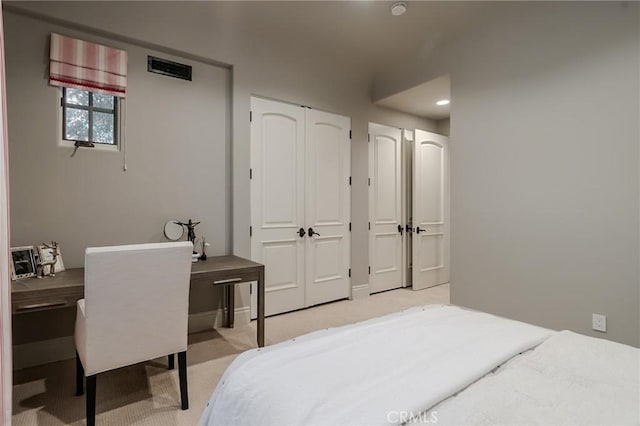 bedroom featuring light carpet