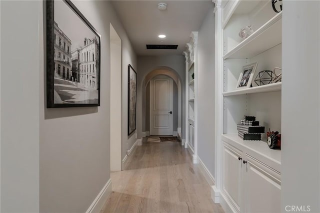 corridor featuring light hardwood / wood-style flooring