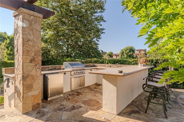 view of patio with a grill and area for grilling