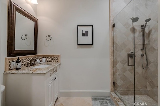 bathroom featuring tile patterned flooring, vanity, and an enclosed shower