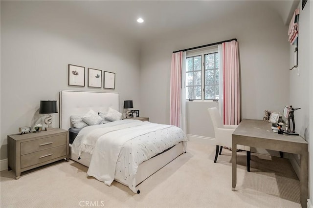 bedroom featuring light colored carpet