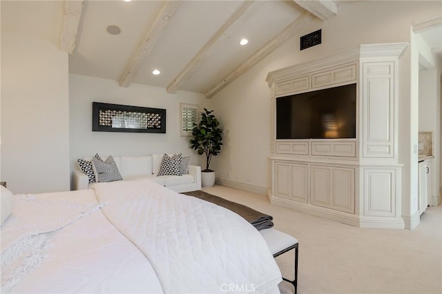 carpeted bedroom featuring lofted ceiling with beams