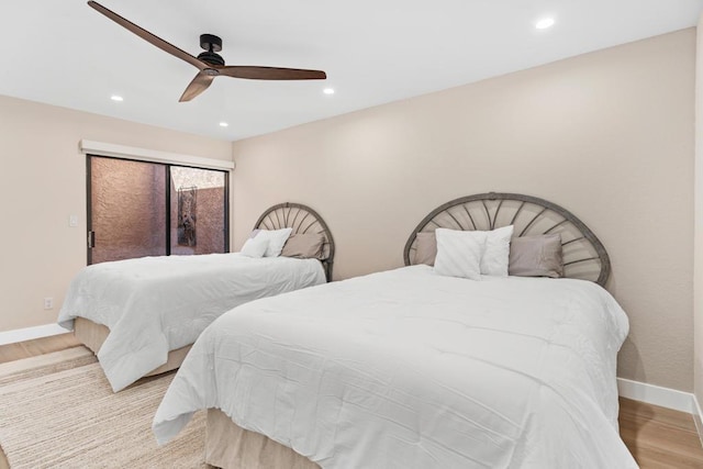 bedroom featuring ceiling fan and light hardwood / wood-style flooring