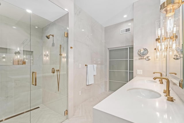 bathroom featuring tile patterned floors, vanity, and walk in shower