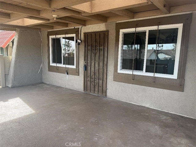 property entrance with a patio area