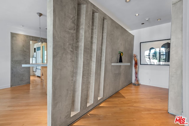 hall with light hardwood / wood-style floors