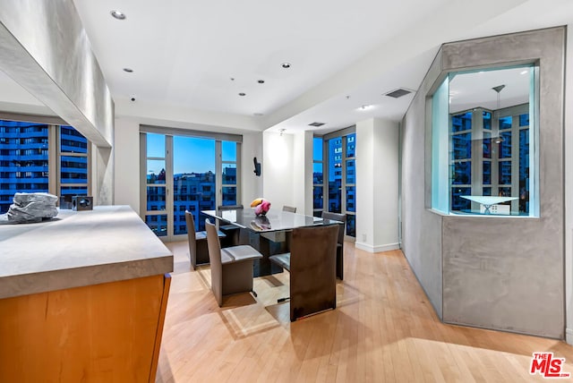 dining room with light hardwood / wood-style flooring