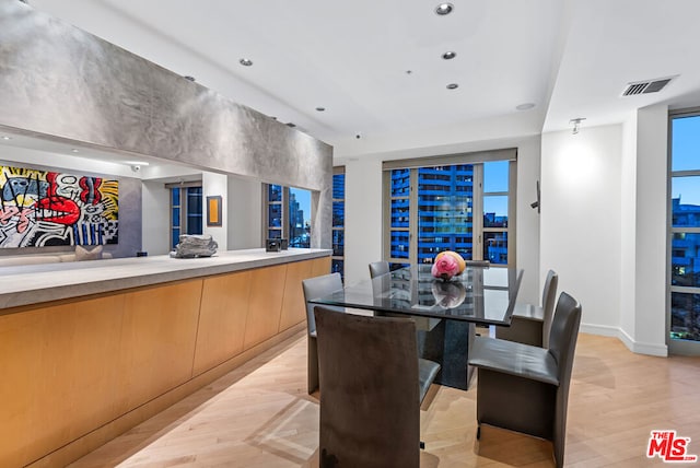 dining area featuring light wood-type flooring