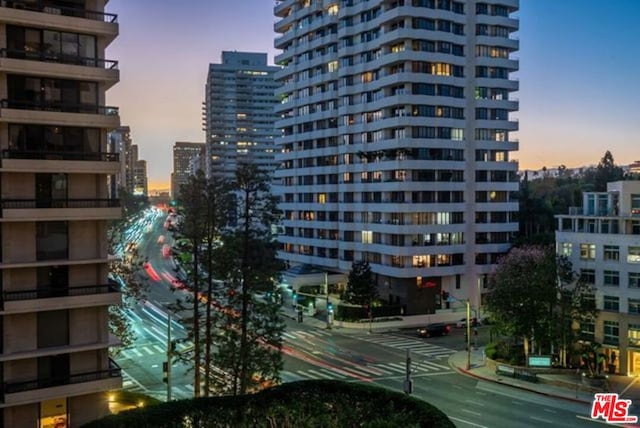 view of outdoor building at dusk