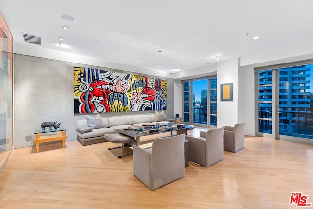 living room with light hardwood / wood-style floors